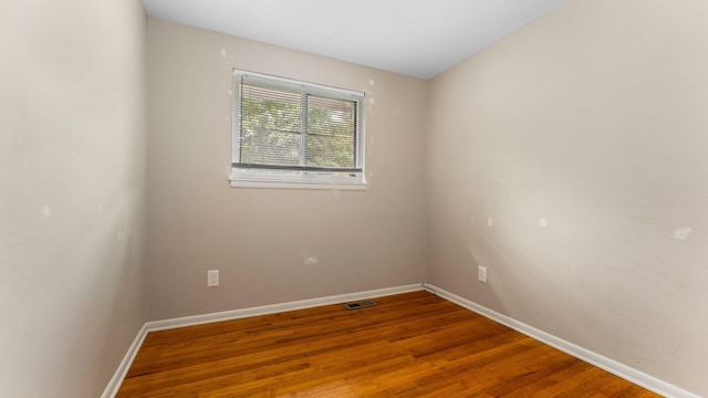 2204 Walter Dr, Ann Arbor, MI 48103 - unfurnished room with baseboards and wood finished floors