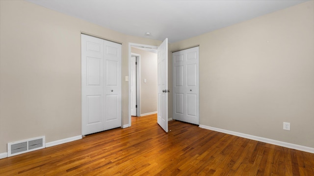 2204 Walter Dr, Ann Arbor, MI 48103 - unfurnished bedroom featuring baseboards and wood finished floors