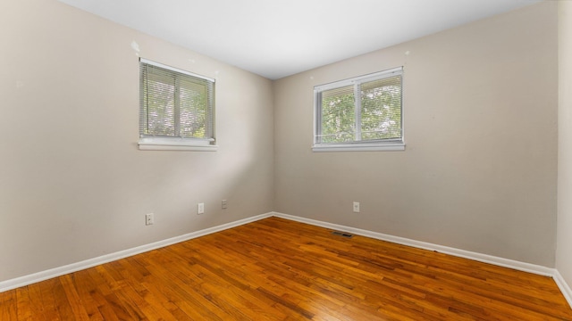 2204 Walter Dr, Ann Arbor, MI 48103 - empty room with baseboards and wood finished floors