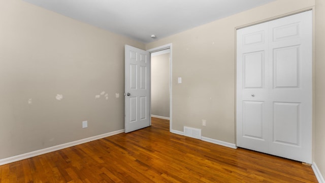 2204 Walter Dr, Ann Arbor, MI 48103 - unfurnished bedroom featuring wood finished floors and baseboards