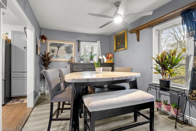 25021 Ecorse Rd, Taylor, MI 48180 - dining area featuring ceiling fan and light wood finished floors