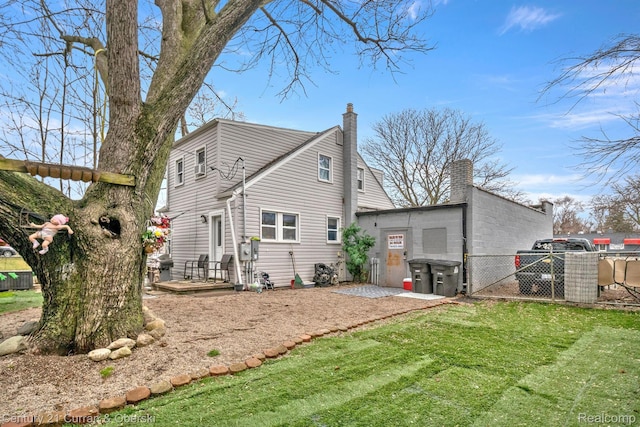 25021 Ecorse Rd, Taylor, MI 48180 - rear view of house with a chimney