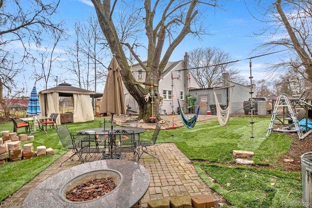 25021 Ecorse Rd, Taylor, MI 48180 - view of green lawn featuring a gazebo, outdoor dining space, and a patio area