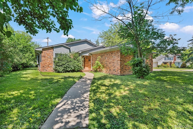 5620 Kaufman St, Dearborn Heights, MI 48125 - view of front of property with brick siding and a front lawn