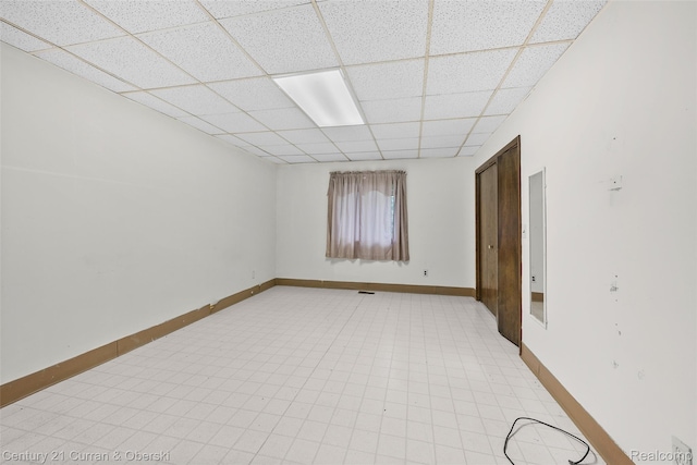 5620 Kaufman St, Dearborn Heights, MI 48125 - empty room with a drop ceiling and baseboards