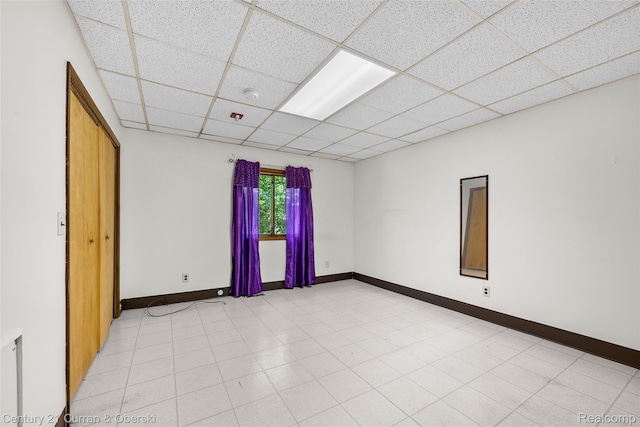 5620 Kaufman St, Dearborn Heights, MI 48125 - unfurnished room with a paneled ceiling and baseboards