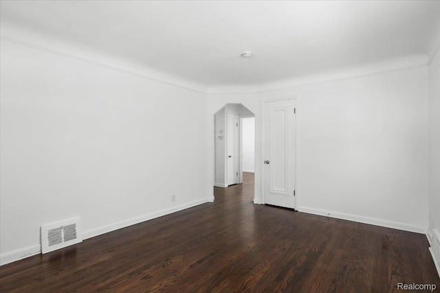 14535 Russell Ave, Allen Park, MI 48101 - spare room featuring arched walkways and dark wood-style floors