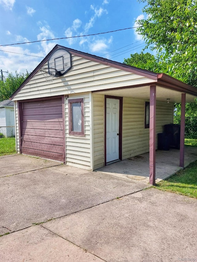 14535 Russell Ave, Allen Park, MI 48101 - detached garage featuring concrete driveway and a carport