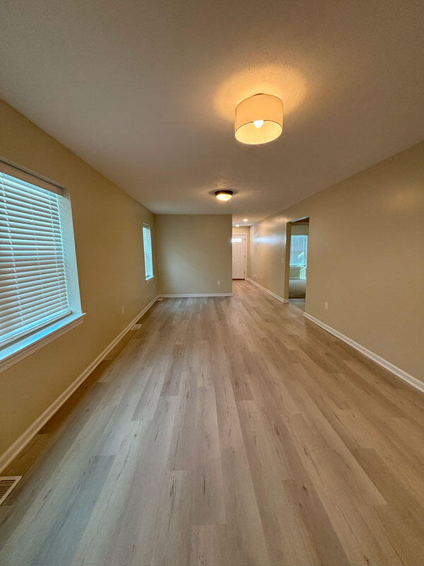 436 Martin Luther King Jr St SE, Grand Rapids, MI 49507 - spare room with light wood-style floors and baseboards
