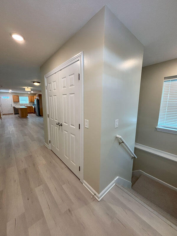 436 Martin Luther King Jr St SE, Grand Rapids, MI 49507 - hallway with light wood-style floors, healthy amount of natural light, an upstairs landing, and recessed lighting