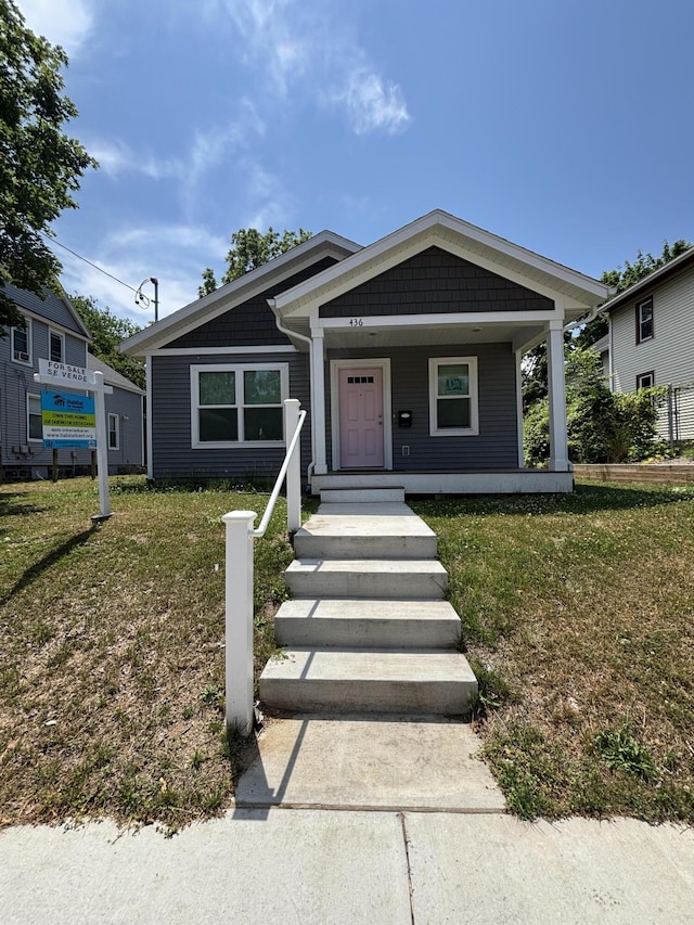 436 Martin Luther King Jr St SE, Grand Rapids, MI 49507 - view of front of house featuring a front yard and a porch