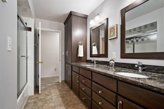 6245 Woodlea Dr, Kalamazoo, MI 49048 - bathroom featuring double vanity and baseboards
