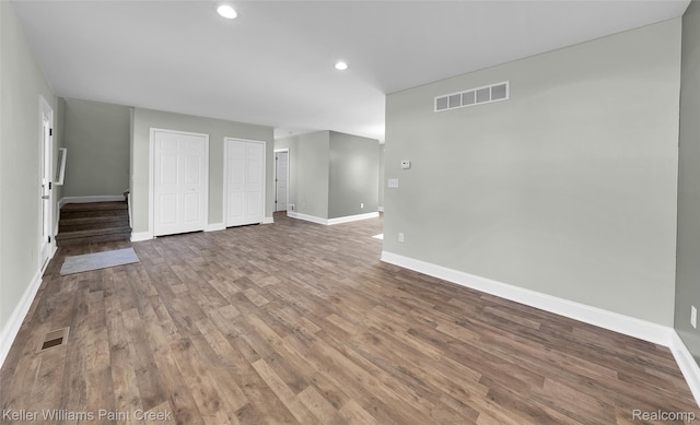 23858 Vassar Ave, Hazel Park, MI 48030 - unfurnished living room with wood finished floors, recessed lighting, and stairs