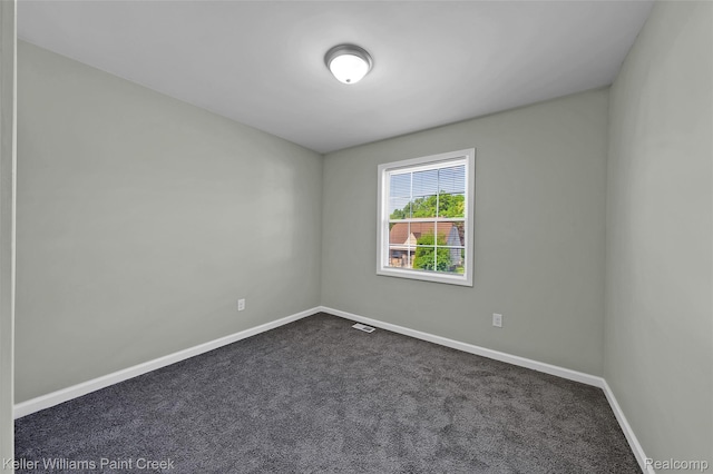 23858 Vassar Ave, Hazel Park, MI 48030 - empty room featuring dark colored carpet