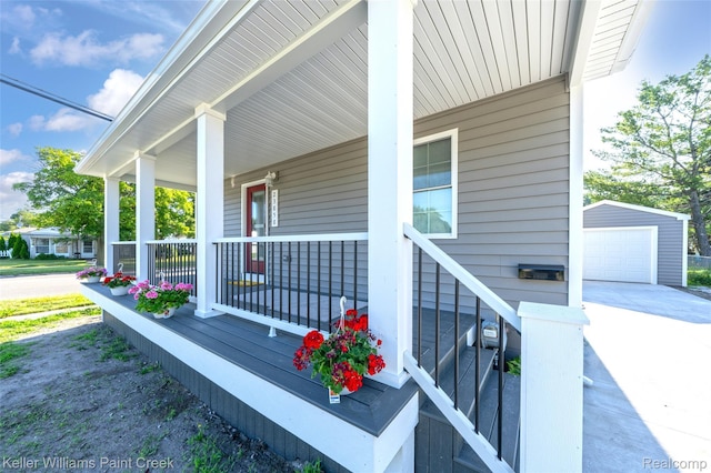 23858 Vassar Ave, Hazel Park, MI 48030 - view of side of property with covered porch, an outbuilding, a garage, and driveway