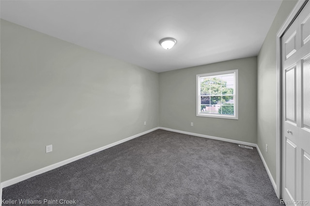 23858 Vassar Ave, Hazel Park, MI 48030 - unfurnished bedroom with dark carpet