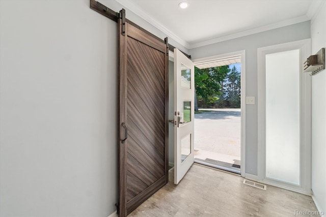 7262 Hatchery Rd, Waterford, MI 48327 - foyer entrance with ornamental molding, light wood-style flooring, a barn door, and recessed lighting