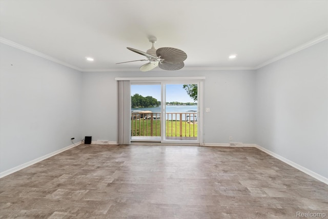 7262 Hatchery Rd, Waterford, MI 48327 - empty room with recessed lighting, wood finished floors, ceiling fan, crown molding, and a water view