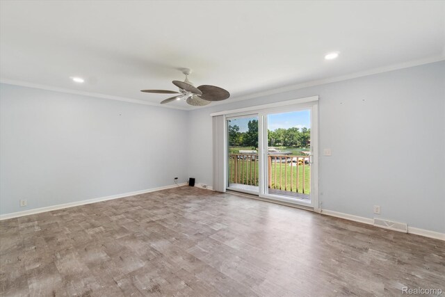 7262 Hatchery Rd, Waterford, MI 48327 - unfurnished room with a ceiling fan, crown molding, wood finished floors, and recessed lighting