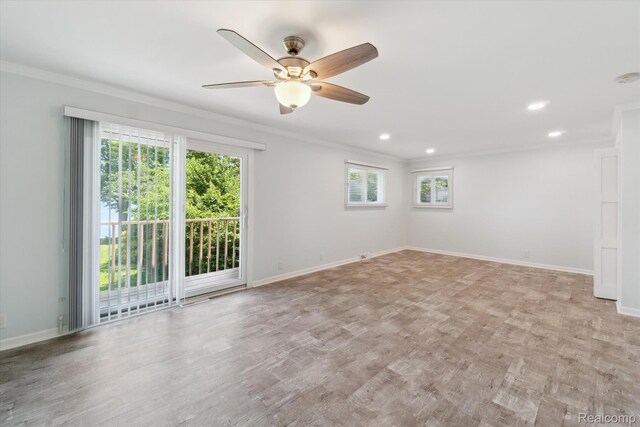 7262 Hatchery Rd, Waterford, MI 48327 - empty room with crown molding, healthy amount of natural light, a ceiling fan, recessed lighting, and light wood-style floors