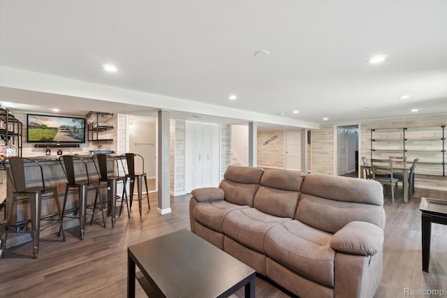 7262 Hatchery Rd, Waterford, MI 48327 - living area with bar with sink, wood finished floors, stairway, and recessed lighting