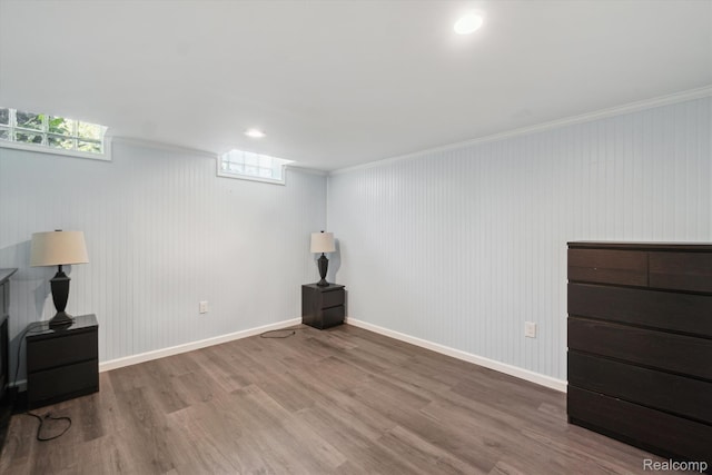 7262 Hatchery Rd, Waterford, MI 48327 - below grade area with wood finished floors and ornamental molding