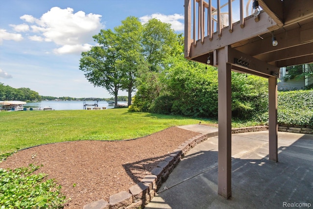 7262 Hatchery Rd, Waterford, MI 48327 - view of green lawn featuring a water view and a patio