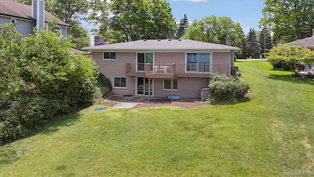 7262 Hatchery Rd, Waterford, MI 48327 - back of house with a chimney, brick siding, a yard, a wooden deck, and a patio