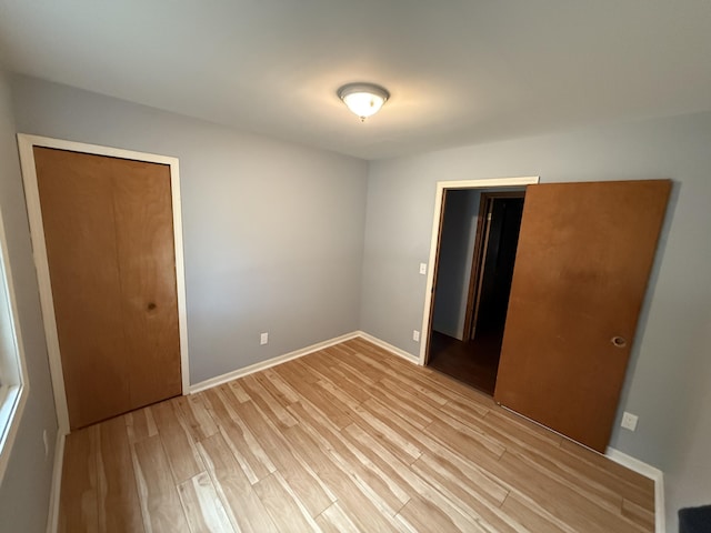 1414 Beard St, Port Huron, MI 48060 - unfurnished bedroom with light wood-type flooring and a closet