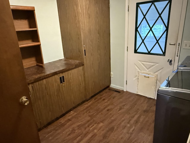1414 Beard St, Port Huron, MI 48060 - washroom featuring dark wood-style flooring and washer / dryer