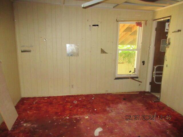 84 Somerset Ave, Battle Creek, MI 49037 - unfurnished room featuring wooden walls