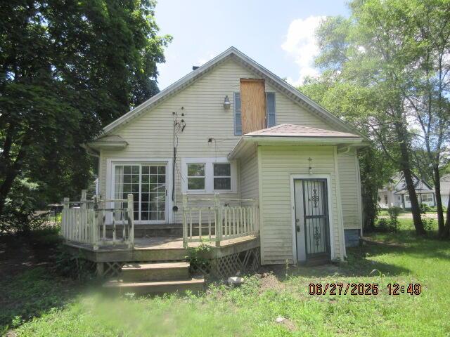 84 Somerset Ave, Battle Creek, MI 49037 - back of property featuring a wooden deck and a lawn