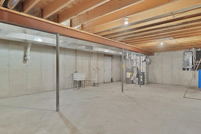 13972 S 5th St, Schoolcraft, MI 49087 - unfinished below grade area with electric panel, water heater, and heating unit