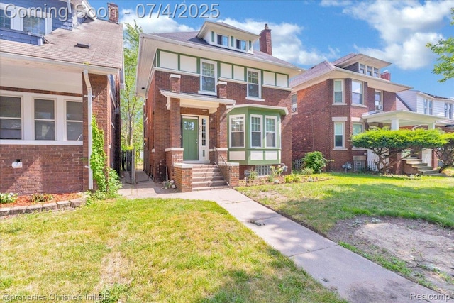 3801 Vicksburg St, Detroit, MI 48206 - view of front of home featuring a chimney, a front yard, and brick siding