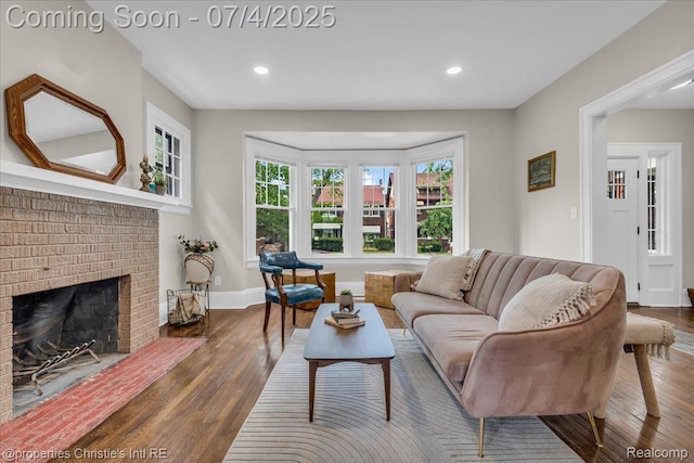3801 Vicksburg St, Detroit, MI 48206 - living room with wood finished floors, plenty of natural light, a brick fireplace, and recessed lighting