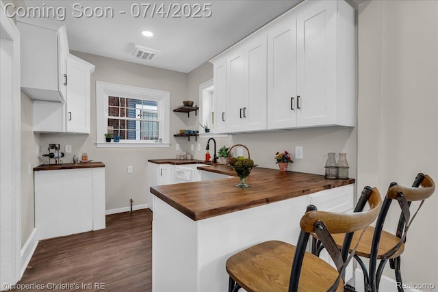 3801 Vicksburg St, Detroit, MI 48206 - kitchen featuring wooden counters, open shelves, dark wood finished floors, white cabinetry, and recessed lighting