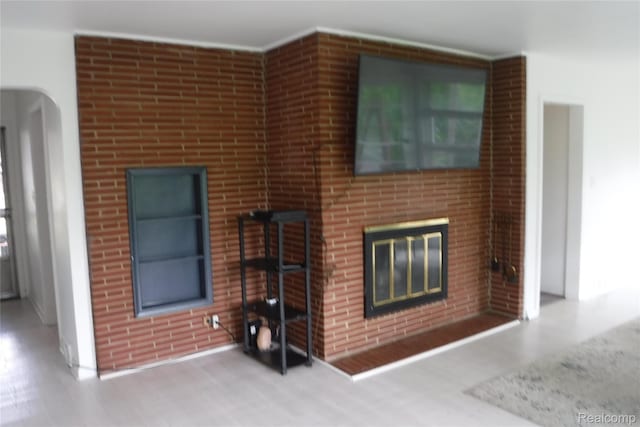 25135 Coral Gables St, Southfield, MI 48033 - living area featuring wood finished floors and a fireplace