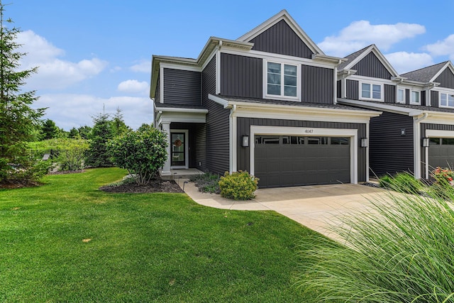 4047 Enclave Way Unit 1, Kalamazoo, MI 49006 - view of front of property with driveway, an attached garage, a front lawn, and board and batten siding