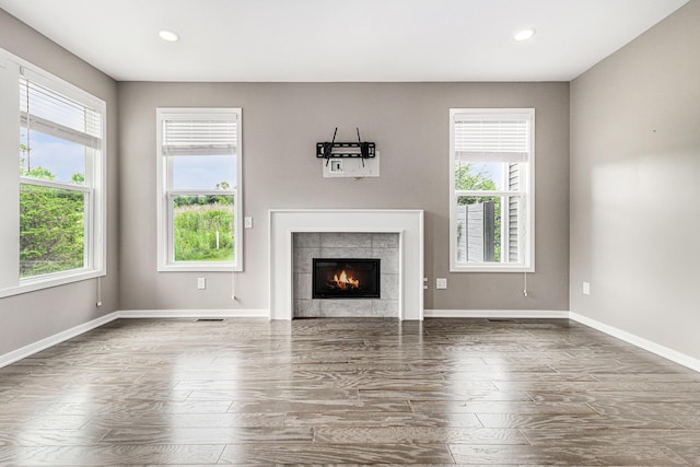 4047 Enclave Way Unit 1, Kalamazoo, MI 49006 - unfurnished living room with healthy amount of natural light, wood finished floors, recessed lighting, and a fireplace