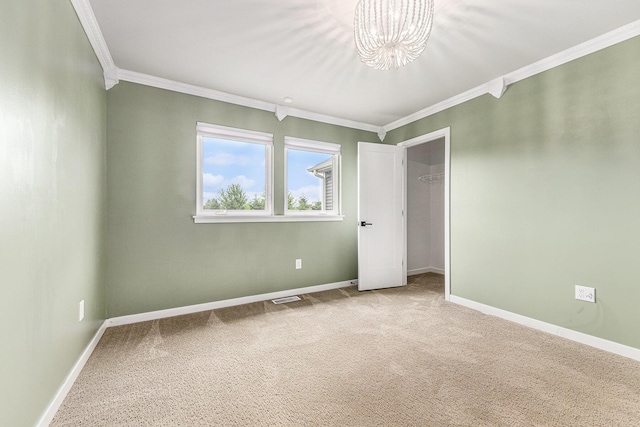 4047 Enclave Way Unit 1, Kalamazoo, MI 49006 - unfurnished bedroom with crown molding, a chandelier, carpet, and a closet
