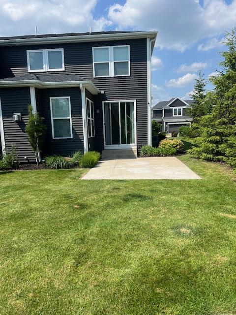 4047 Enclave Way Unit 1, Kalamazoo, MI 49006 - back of house with a patio area and a lawn
