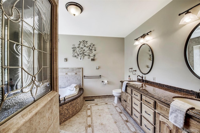 24559 S Klingville Rd, Chassell, MI 49916 - bathroom featuring a bath, double vanity, and tile patterned flooring