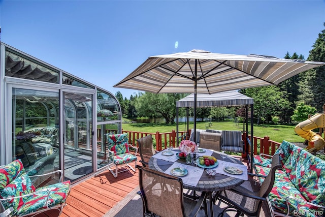 24559 S Klingville Rd, Chassell, MI 49916 - deck with outdoor dining area and a lawn
