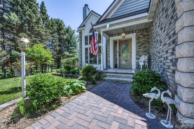 24559 S Klingville Rd, Chassell, MI 49916 - entrance to property with brick siding and a chimney