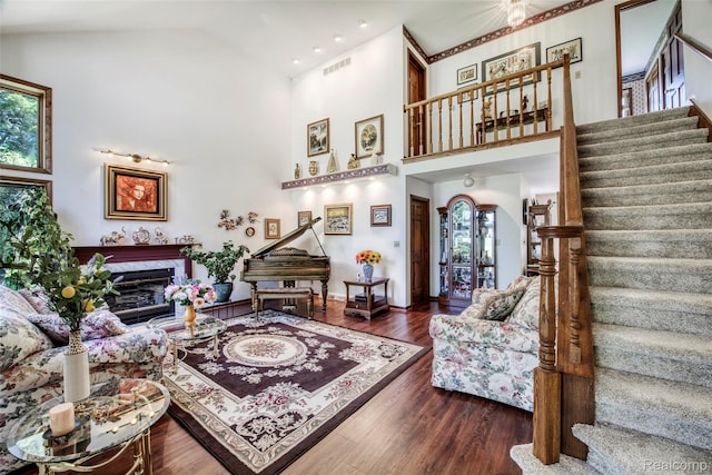 24559 S Klingville Rd, Chassell, MI 49916 - living room with stairway, a premium fireplace, high vaulted ceiling, wood finished floors, and recessed lighting