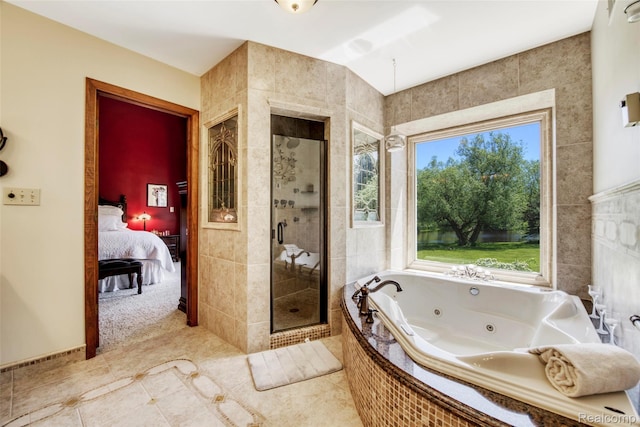 24559 S Klingville Rd, Chassell, MI 49916 - ensuite bathroom with a stall shower, a whirlpool tub, and tile patterned flooring