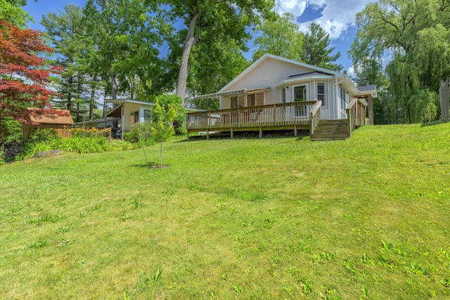 22770 Oak St, Pierson, MI 49339 - rear view of house with a deck and a lawn