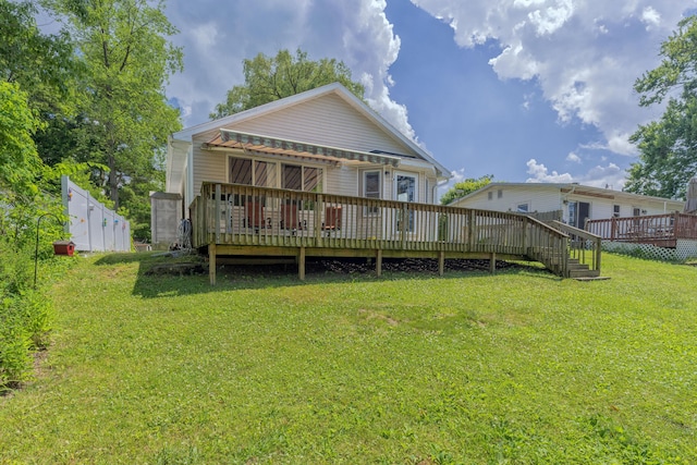 22770 Oak St, Pierson, MI 49339 - rear view of property featuring a deck and a yard