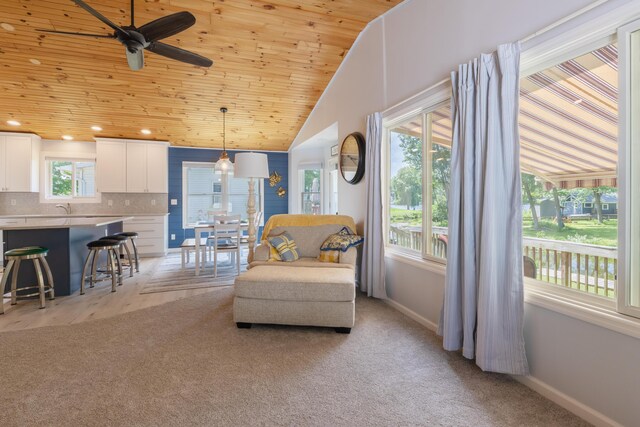 22770 Oak St, Pierson, MI 49339 - living room featuring light colored carpet, wooden ceiling, a ceiling fan, recessed lighting, and vaulted ceiling