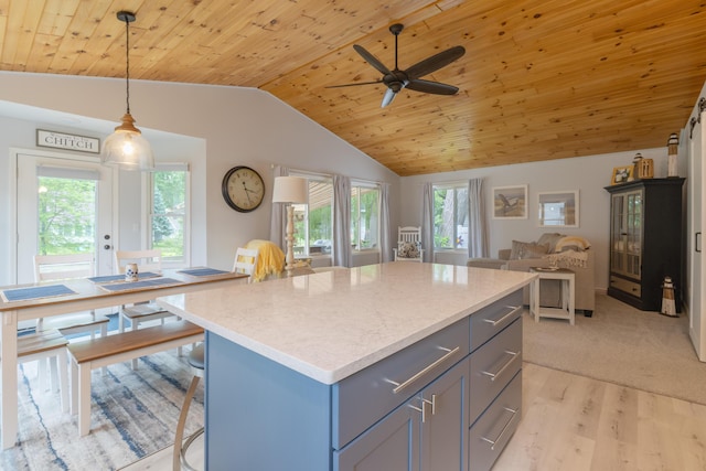 22770 Oak St, Pierson, MI 49339 - kitchen featuring open floor plan, gray cabinets, vaulted ceiling, light wood finished floors, and wood ceiling